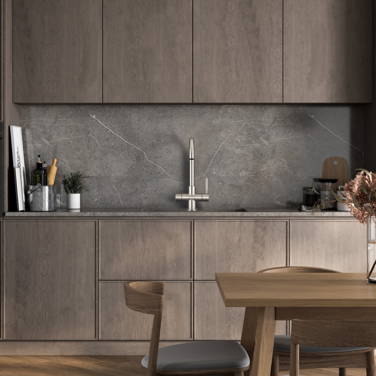 Modern kitchen with wooden cabinets, gray backsplash, and a dining table.