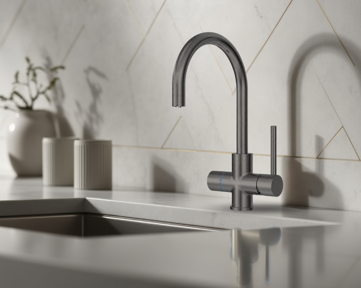Modern kitchen sink with a faucet in a clean, minimalistic setting. neotap multi